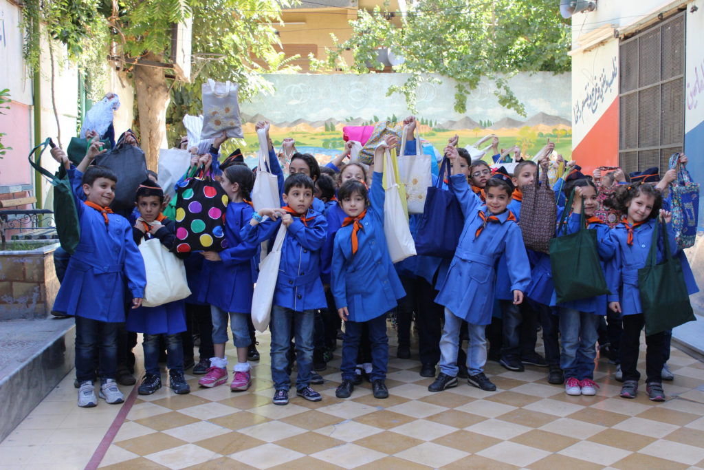 School children in Damascus, Syria show off their new School Kits