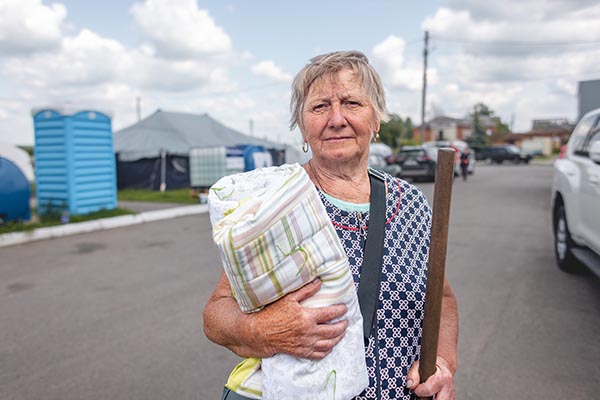 Anna Prokopenko, 69, with her LWR Mission Quilt.