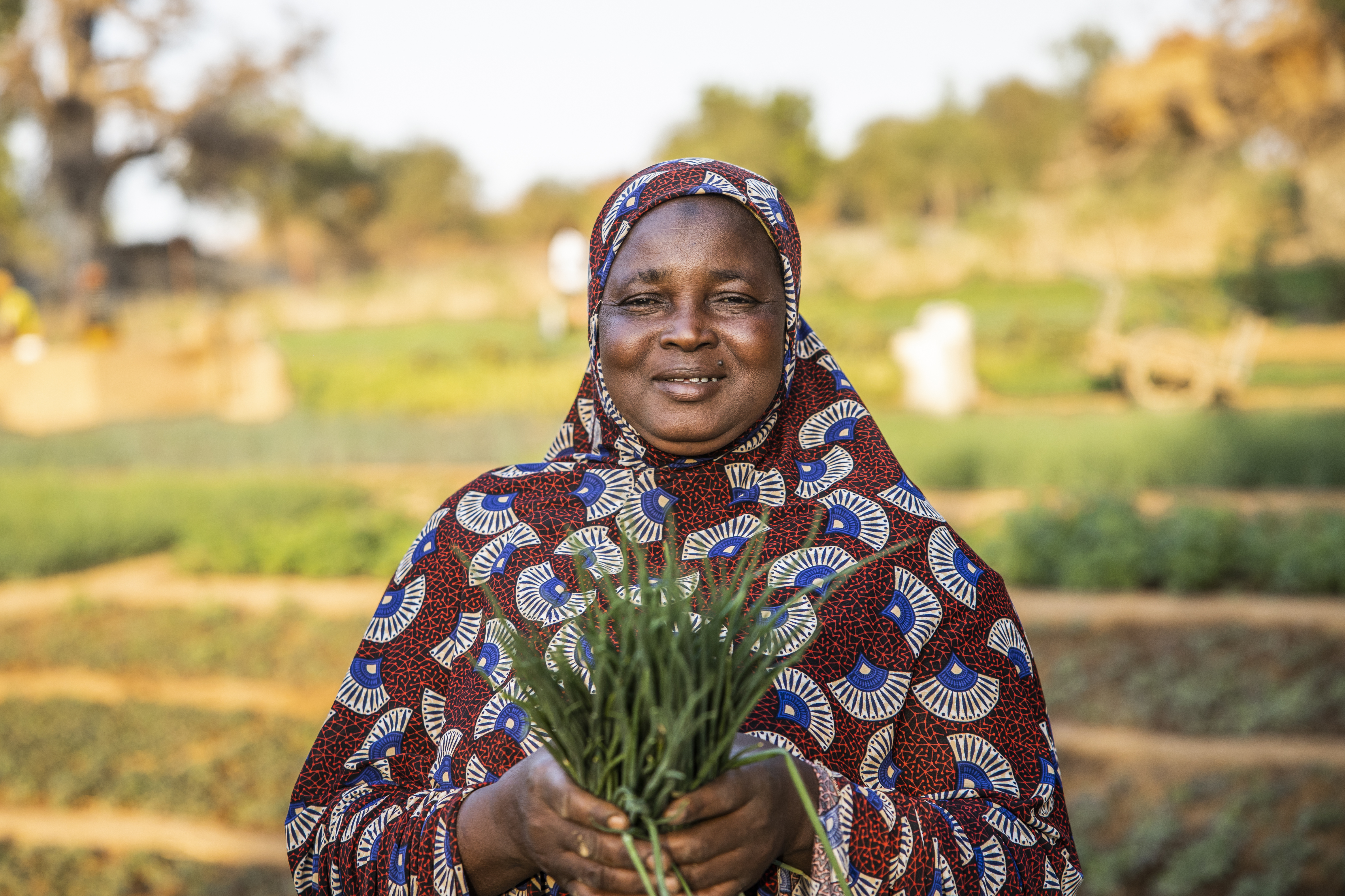 Woman holding vegetables