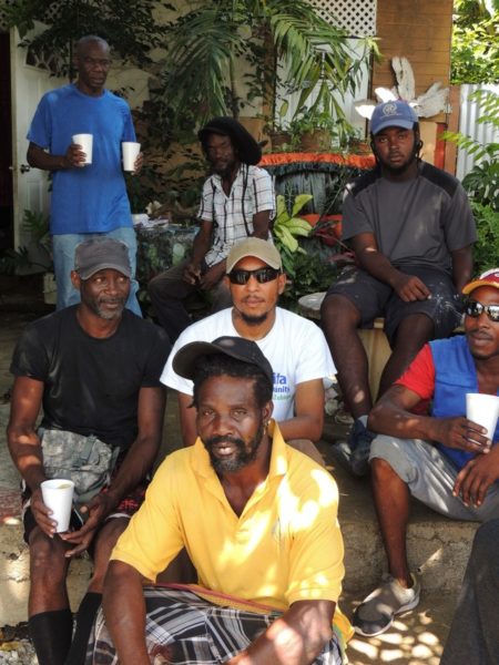 Staff from LWR partner Habitat for Humanity with a group of construction workers helping to rebuild in Dominica.