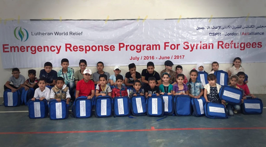 boys and girls holding School Kits