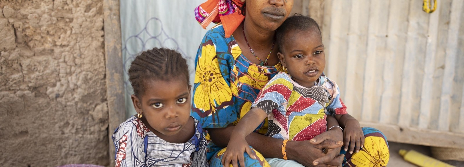 Mother holding her two children