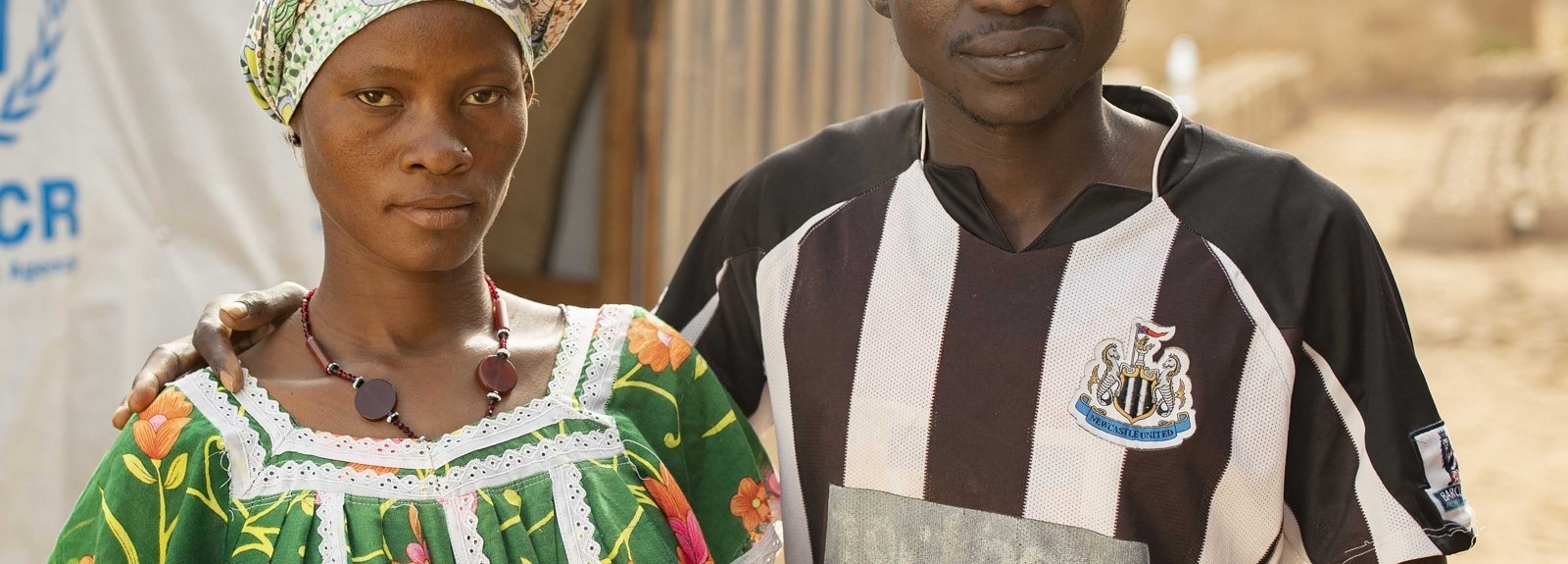 Adama and his pregnant wife, Jeneba