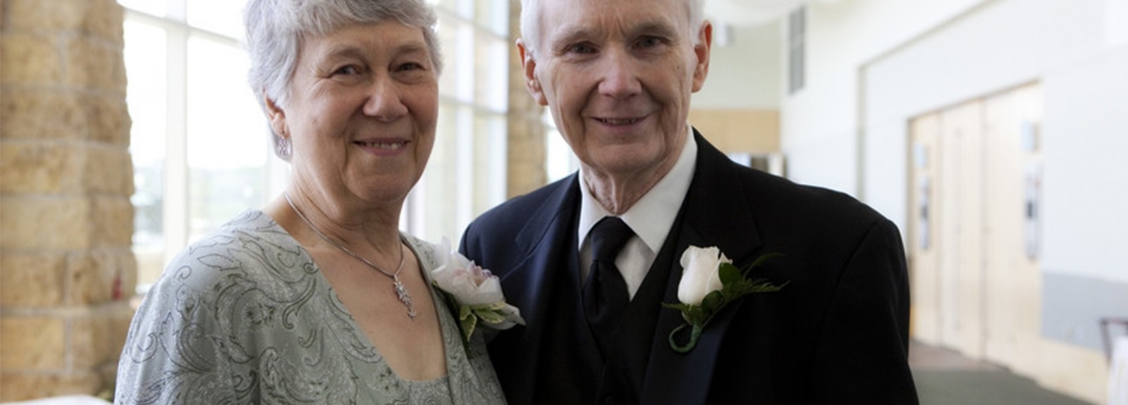 A woman, left, and a man are smiling 