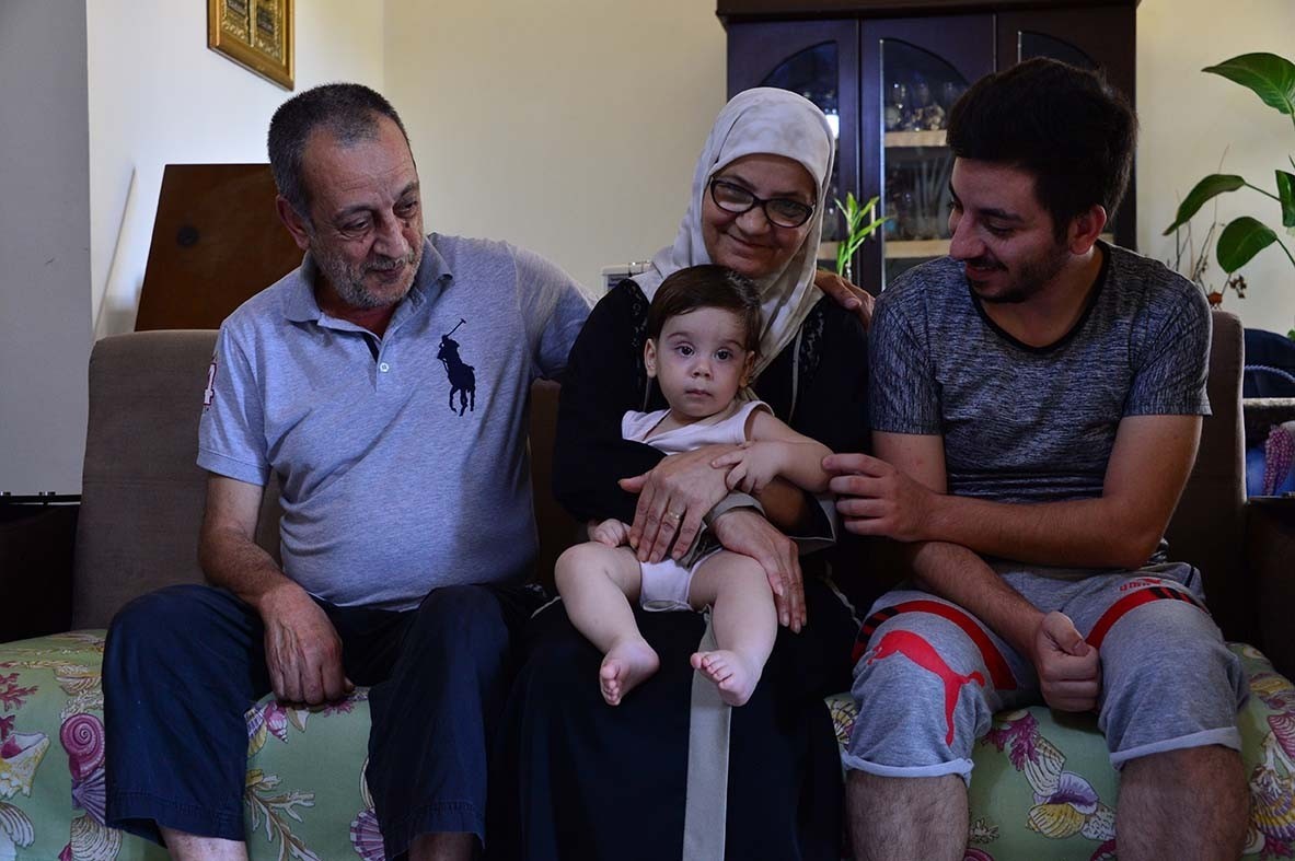 The Hammal family, out in Beirut’s southern suburbs, exemplify the collapse of Lebanon's middle class. Mohammad Hammal (right) left his job at Beirut’s port just a couple of hours before the Aug. 4 explosion. He sat with his mother and father, and his infant son, Rafic, watching the tragedy unfold. He had already been cut back to half time as an employee, putting a strain on the family’s finances. The next day he found out his job was gone. Mohammad is the family’s breadwinner in their middle class home.
