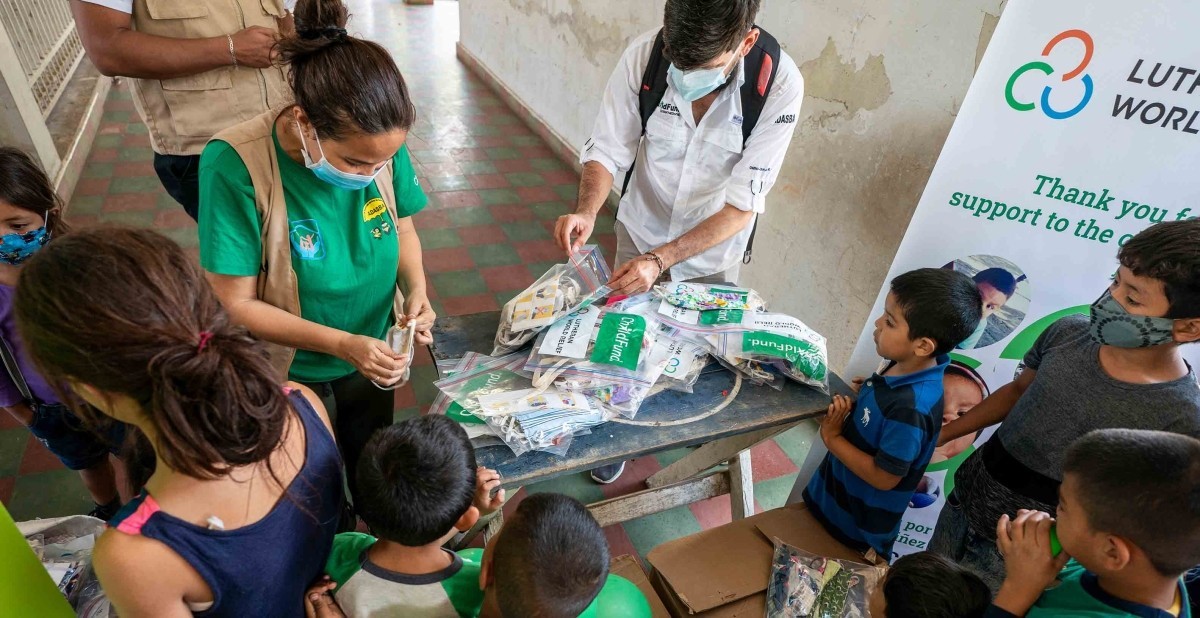 A COVID prevention kit distribution co-sponsored by Lutheran World Relief and ChildFund at a family shelter in Santa Barbara, Honduras.