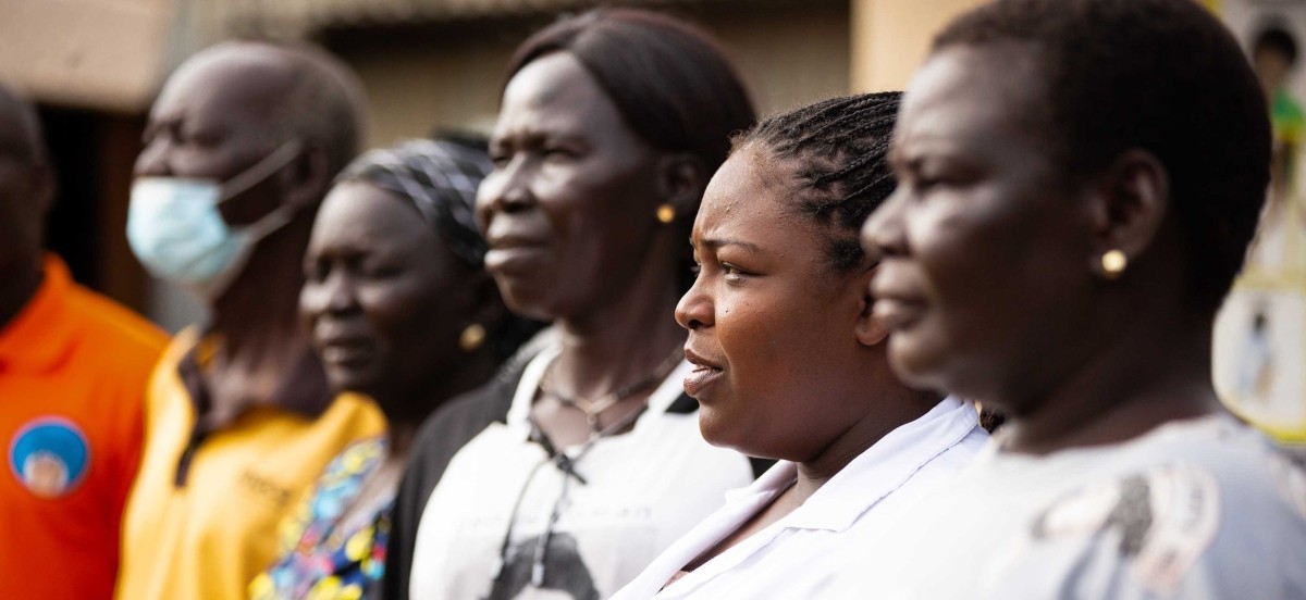 Health workers stand in a line
