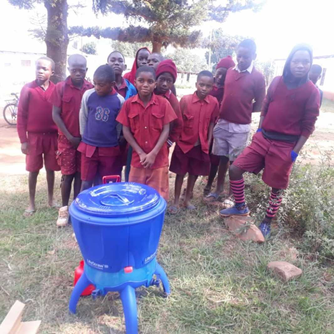 Students pose with their new water filters, provided by you, following Cyclone Idai. Along with the water filters, our local partners are teaching students and school staff improved hygiene and sanitation practices. (Photo courtesy of Smile for Africa)