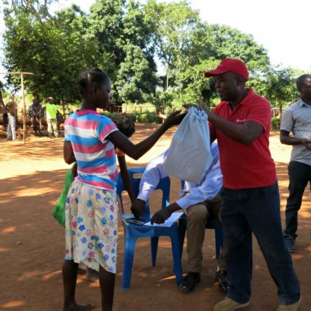 Local staff in Mozambique distribute LWR School Kits to survivors of Cyclone Idai. (Photo courtesy of Save the Children)