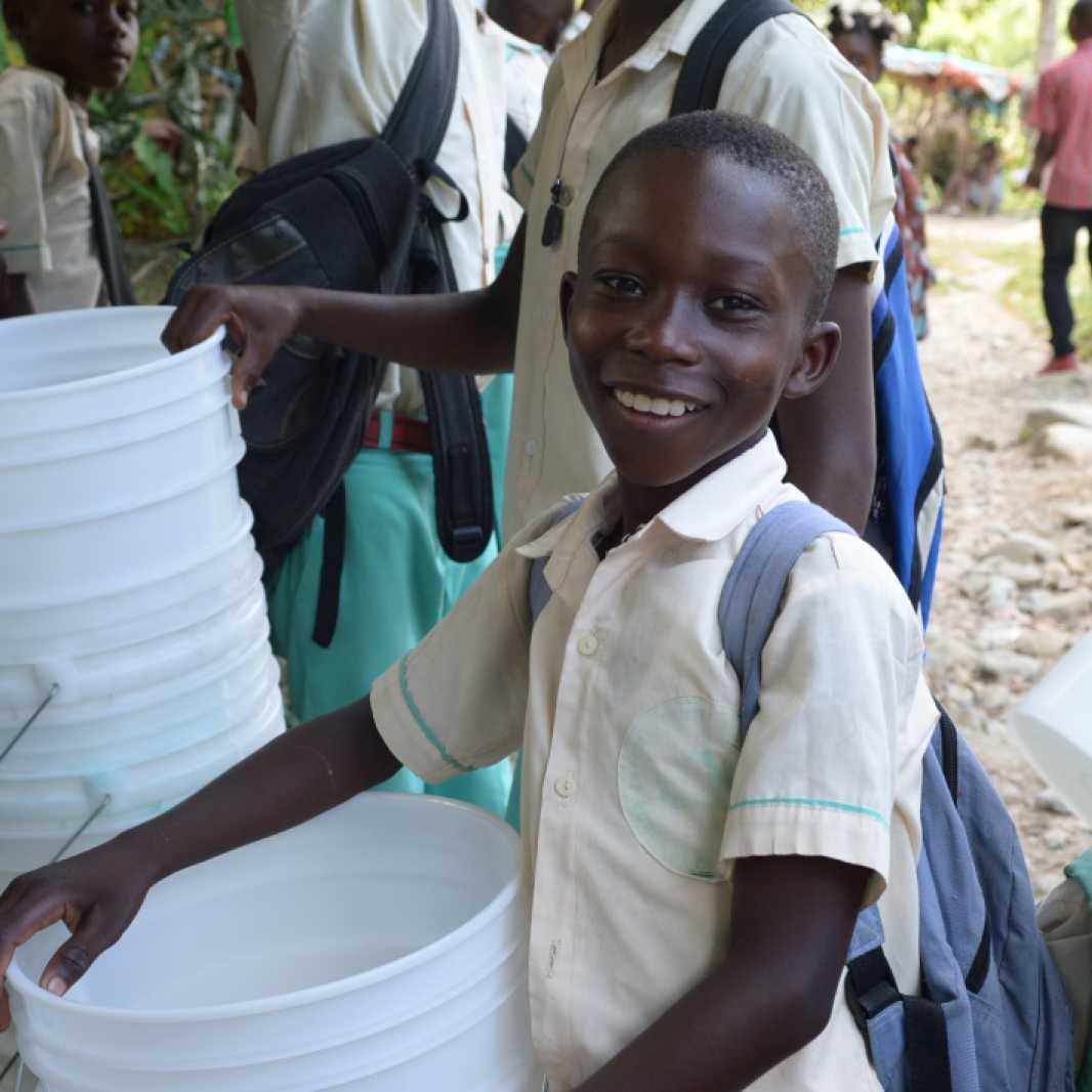 In Haiti, buckets are an important tool to prevent the spread of cholera. IMA World Health works with partners in Haiti to distribute buckets, water purification supplies, and conduct sanitation and hygiene education activities.