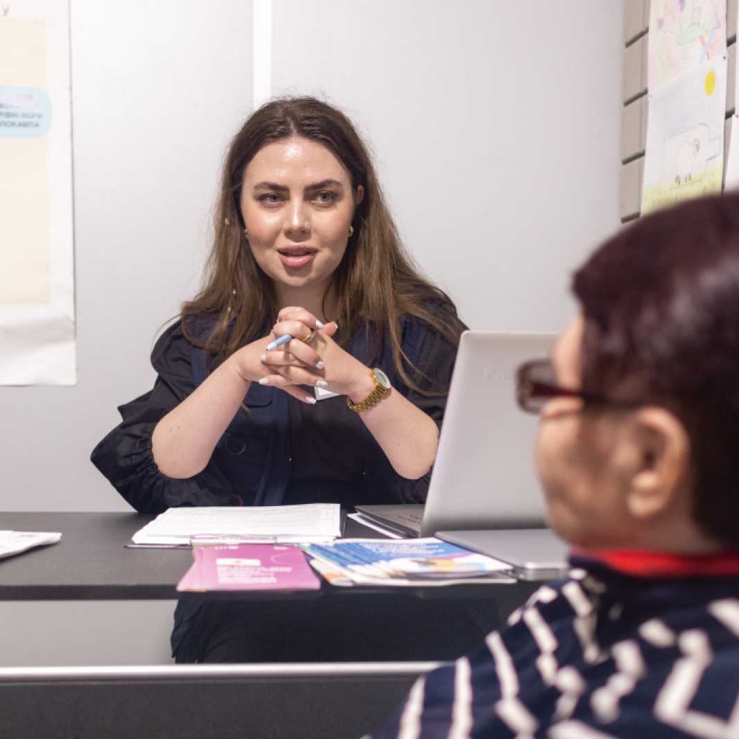 Anastasia Solovova meets with a Ukrainian woman for a counseling session. Anastasia is a psychologist working in the mobile medical clinic.