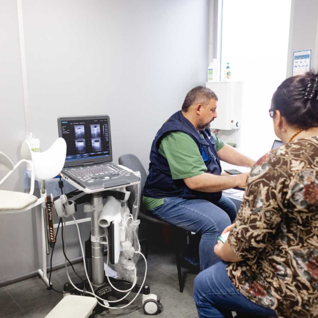 Dr. Vitalij Olkhovyk sees a patient in the mobile medical clinic. Dr. Olkhovyk is an OB/GYN and ultrasound specialist and is able to perform specialty medical services such as colonoscopies and thyroid screenings.