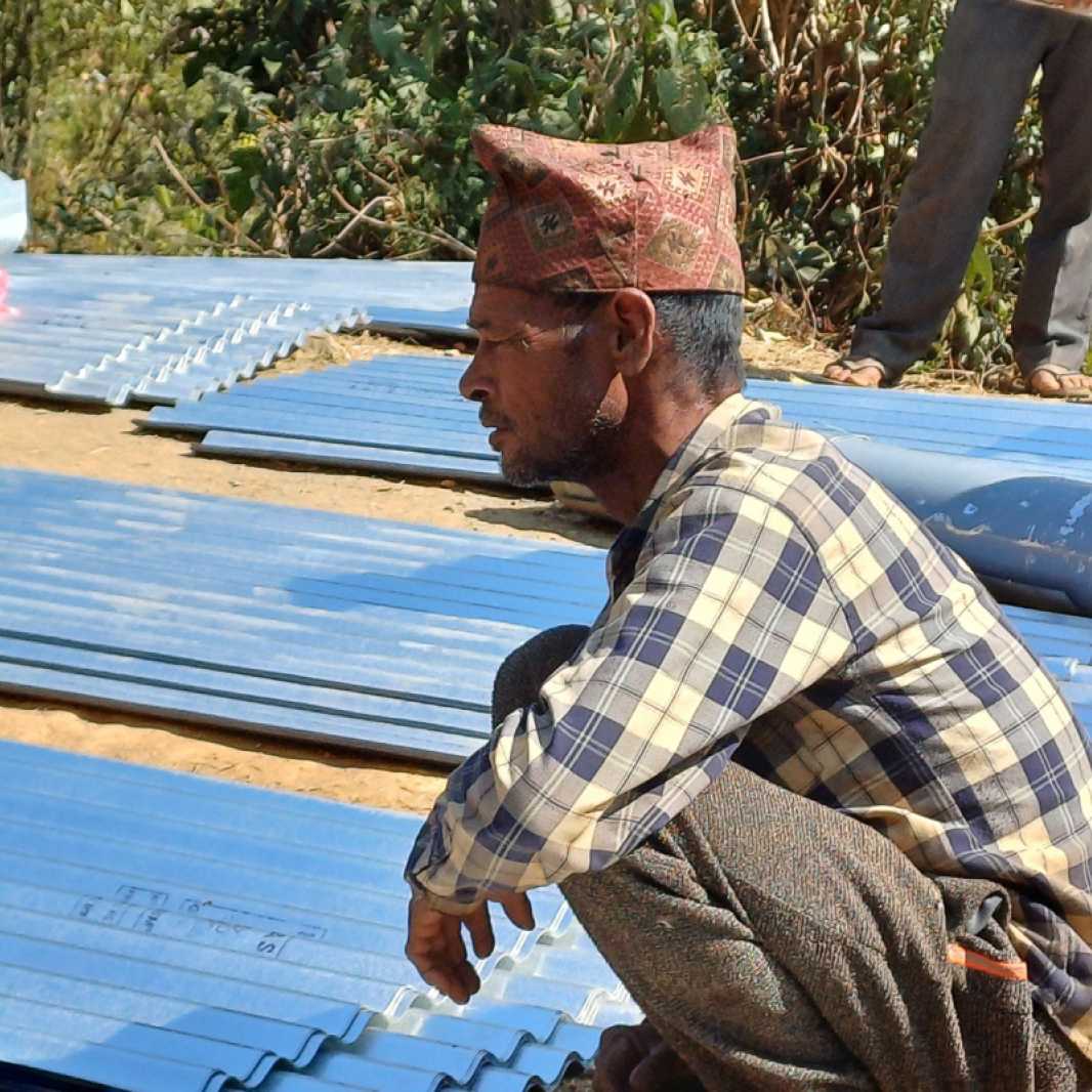 Duddha with building materials for his new home