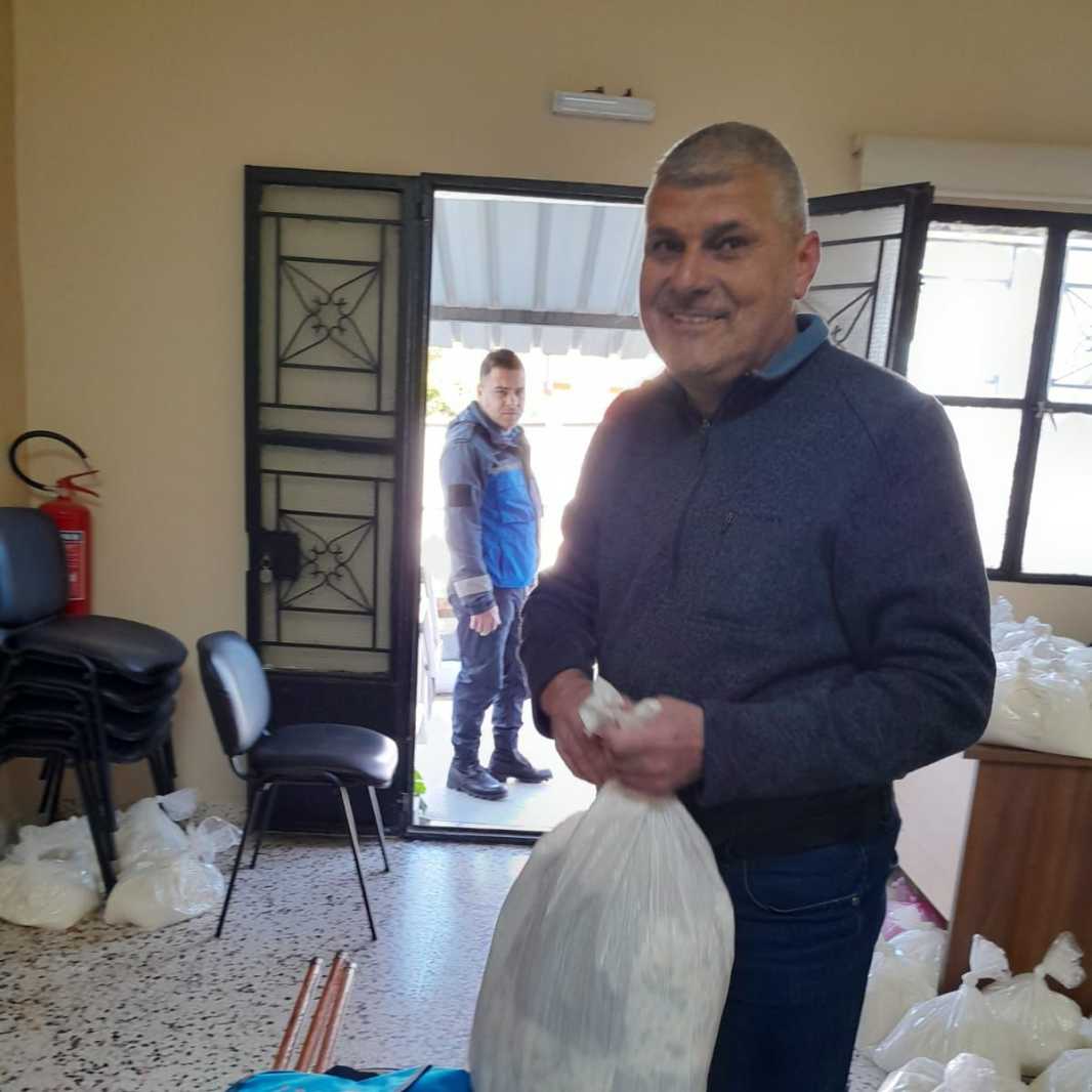 Sami Kaddouh receives supplies.