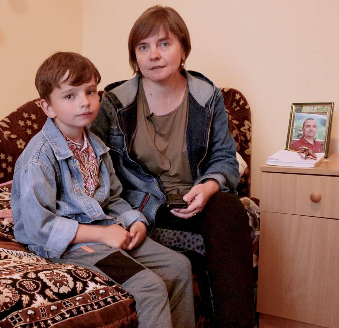 Ukrainian IDP Kamins'ka Ludmyla with her six-year-old son Svaitoslav Kaminskyj at the LWR quilt and kit distribution at the Morshyn sanatorium in Morshyn (Morshin), Lviv Oblast, Ukraine on the western side of the country. This particular sanatorium (medium-term IDP housing facility) saw a significant increase in the number of IDPs requiring free accommodation in late May 2022. Currently housing IDPs who have not returned to their homes due to active battles or destroyed homes. Mainly IDPs from Kharkiv, Lugansk, Kherson areas. Mostly, women with children, around 70 children.  Ludmyla and her son left their home in Donetsk because of nearby fighting. “Because I feared for my child's life, I decided to leave rather than stay there.” Ludmyla recalls. She says that the community of Morshyn has welcomed them “with open arms.”  All of the fees for Ludmyla and Svaitoslav’s to stay in this sanatorium and eat the meals that are served have been covered by Corus International.  She keeps a photo on their night table in their room in the sanatorium of Svaitoslav’s father who died six months before from Covid-19.  Ludmyla only wants to return home as long as the area they are from remains Ukrainian, she loves Ukraine and wants to raise her son in the Ukrainian nation.   On May 31, 2022, LWR Quilts and kits (school, baby, and personal care) were distributed at the Marshy sanatorium to IDPs by Corus International’s Chief Humanitarian Officer Tamara Demuria along with Program Manager Daniel Brown, Vice President of External Relations and Engagement Eddie Byrd and Senior Manager of Philanthropic Initiatives Maryna Zuy Hayes. The distribution was met with joy and appreciation.  Luybov Biliska, the Deputy Director for Legal, Personnel and Organizational Work at the Morshyn sanatorium says, “With the beginning of the war our Sanatorium became a great refuge for all citizens of Ukraine, who moved from territories on which active hostilities were conducted, or affected from active combat operations. We sheltered about 3,000 people since February 24, who needed protection, who left those territories came to us for a long stay, or short-term, in order to further go abroad.”  “The first days of the war they were very difficult for all of us. We worked seven days a week and almost without sleep. People drove anxiously, we cried with them, took in those frightened children. We don't like to talk about that, it is very difficult for us to think about it. We hugged them like family.”  There are currently about 300 people staying in the sanatorium. Since the start, 720 people have stayed free of charge. They had to quickly open all of their buildings that had been shutdown for the winter to accommodate the demand of IDPs who were seeing refuge since the very first day of the war.   “Since the situation changed in Kyiv, a lot of people returned to Kyiv, but we are hosting now those, who came from Lugansk, Donetsk, from Mykolaiv regions, those that are having heavier times right now. One of the buildings that Corus is sponsoring, we have 70 children.” Luybov continues. “There are many requests that come, but we are forced to refuse due to lack of funds.”  The building Corus is sponsoring is called “Svitanok,” which houses about 30-40 percent of the sanatoriums total IDPs.  “We are planning in stages offer a medical base, although the prospect is disappointing because people who need shelter today such, cannot all allow treatment, although we provide them with first aid and they are provided with medical care in the municipal hospital,” says Luybov.  Through the month of March, the sanatorium was covering all of its own costs to house IDPs. They are grateful for Corus’ support in more recent weeks. The sanatorium is still covering the costs of everyone outside of the Svitanok building.  “Thanks to Corus we have the opportunity to receive our citizens today, provide them with proper living conditions. They were warmed – we paid for gas supply services, heat supply, provided with cold and hot water, provided with three meals a day, they have the right conditions,” says Luybov.  “Children in the early days asked for all bomb shelters … The only thing they were interested in: where is your bomb shelter? If you look at these people now, these are completely different faces. There is peace, there is a gleam in their eyes that we see and we are happy that we're able to help these people,” says Luybov. According to OCHA’s situation report published on June 24, 2022, there are 7.1 million IDPs as a result of Russia’s invasion of Ukraine on February 24, 2022, and the ensuing war.  As of June 3, 2022, LWR is partnering with the Federation of Trade Unions of Ukraine (FPU) to support six union-run centers that are being used for temporary housing. We’re helping more than 15,000 internally displaced persons (IDPs) forced to flee heavy fighting in the eastern and southern parts of the country with no other means of support. We are also providing toys for children, food and essential supplies and equipment, like folding beds, pillows, heaters, laundry detergent, toilet paper, and person hygiene items.  According to OCHA’s situation report published on June 24, 2022, there are 7.1 million IDPs as a result of Russia’s invasion of Ukraine on February 24, 2022, and the ensuing war.