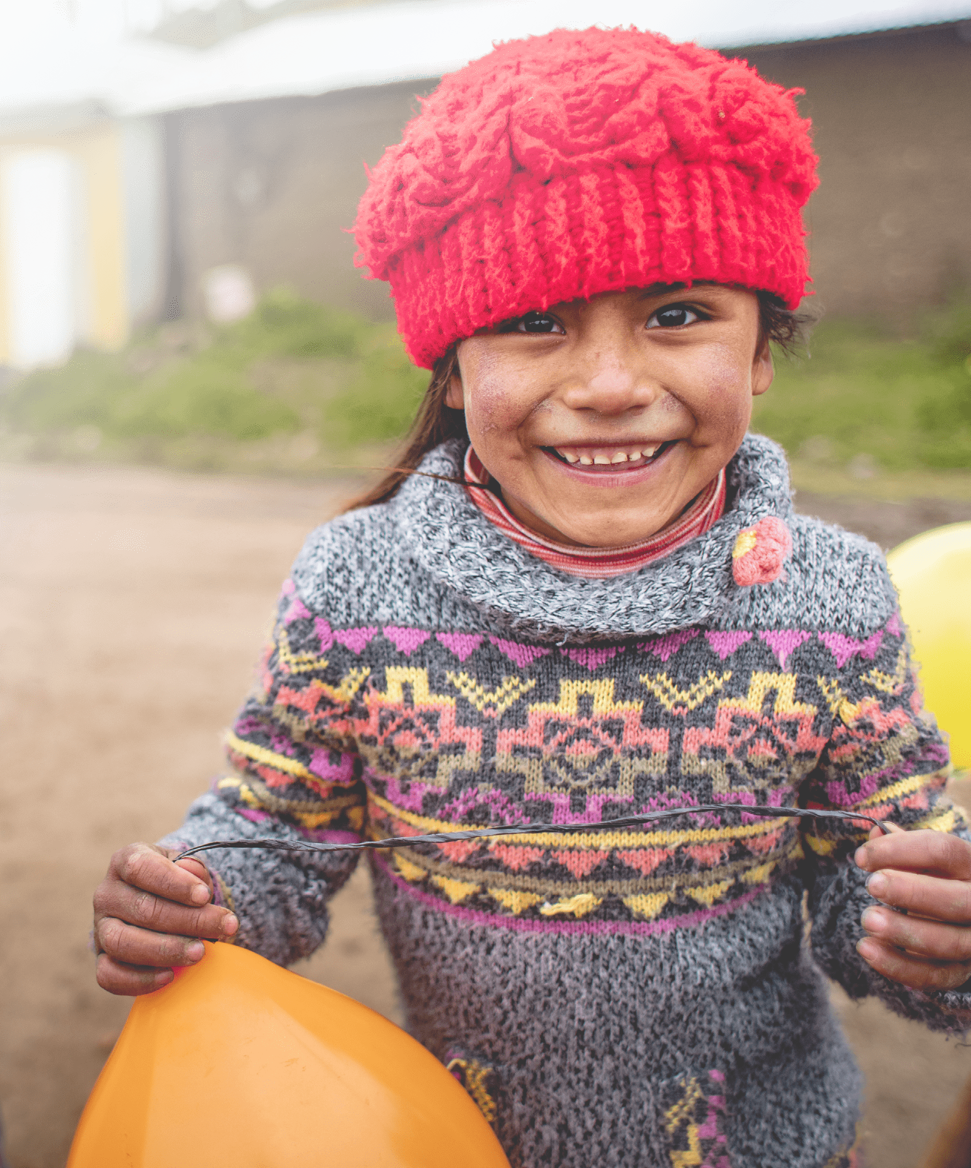 Children in the Cocha community in Castrovirreyna, Peru, preparing for a traditional Latin American celebration called Carnaval. Carnaval is celebrated during the week ahead of Lent. During the celebration, participants dance around a balloon-filled tree and take turns trying to chop it down. Whoever succeeds, must plan the celebration the following year.  In a high Andean region of Peru called Castrovirreyna, Lutheran World Relief supports a program led by partner Center for Integrated Community Development (CEDINCO) to reduce malnutrition. In eight communities over 12,000 feet above sea level, poverty and the harsh climate make it difficult for families to produce enough food. There, CEDINCO teams help indigenous families to grow nutritious food and improve the nutritional status of their children.    Earlier, the staple diet of the region was mainly grain and potatoes, with little protein. “The food was very poor,” says Irene Flores, CEDINCO’s director. Children suffered from chronic malnutrition and early childhood anemia.    Supported by LWR, CEDINCO's program helps families create mud-walled greenhouses to grow vegetables; raise guinea pigs and chickens for meat; and maximize their food production in other ways. They also provide trainings for mothers about the importance of good nutrition.    “The availability of food has increased and diversified,” in the program’s eight communities, says Irene.   In collaboration with Growing Hope Globally, LWR’s program increases yields of nutritious food by training indigenous farmers on organic production methods including establishing seed banks, improving post-harvest storage, and establishing family greenhouses. By strengthening small livestock rearing, families have greater access to meat. Farmers are also trained to market their organic potato and vegetable crops — for example, selling to organic potato-chip markets in Europe — and manage their farm income.   The program coordinates with educational institutions and health facilities to promote social and behavioral change that advances good nutrition and hygiene habits. Home visits raise awareness about anemia and parasites and teach children about the importance of washing hands. Families are also trained in keeping their homes clean by separating their small animals from areas where people eat and live.    LWR has also launched a COVID-19 vaccine awareness campaign in Castrovirreyna in collaboration with the local health posts.   LWR is supporting this work through the Promoci n de entornos favorables para la seguridad alimentaria y la nutrici n familiar en Castrovirreyna – Per  (Promotion of favorable environments for food security and family nutrition in Castrovirreyna – Peru) project. LWR has been working with CEDINCO since 2011 to improve food security, strengthen agricultural development, and support household health and nutrition in Castrovirreyna.    Photo by Amy Vu. Photo Releases: https://lwr.sharepoint.com/:f:/g/Emc654yswxdImo6YON1t0dwBeZzaSUW5sYpujACRth8TUQ?e=7qlGkm