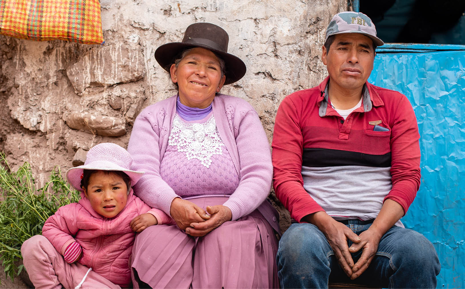 Luciana Sosa with her grandparents Eusebia Canales and Juvenal Sosa Quilca. Eusebia Canales and her husband Juvenal Sosa Quilca live with their family in the Suytupampa community in Castrovirreyna, Peru. They live on a farm where they raise cuy (guinea pigs), hens, and cows. They also grow a variety of vegetables in their greenhouse and grains in their fields. They are able to maintain a varied and nutritious diet thanks to the support of LWR’s local partner, Center for Integrated Community Development (CEDINCO). They also now have a surplus of produce that they are able to sell at markets for a profit in order to supplement their pantries with other food items that they don’t produce themselves. This allows for further diversification of their diet.     “Thanks to CEDINCO, which gives me a lot of support. I am grateful also for my cuys. I feed my children, myself.” says Eusebia. “The same in the greenhouse. I have my food, my chard, my spinach, my lettuce ... My hen is the same way. I sell eggs. I feed my children. That’s how I live.”      “Thank you. CEDINCO has provided that strategy, that support. I really appreciate them. And they always support me always ... they advise me, they encourage me. And I thank them, and Ms. Irene, the young people here, Mrs. Meylin. They support us quite a bit.” says Eusebia.      “Before, there was no alfalfa here. There was no alfalfa. Those who had money, had alfalfa and cows as well. But now we have-- Almost 80% of us have all cows.” says Juvenal. “Everyone has cheese. Everyone has milk. So, at least with food there are 25 people working with CEDINCO now, at least it's changing now. It has already changed.”    Eusebia says, “More than anything, my cow gives me money. It supports me. I earn a living with it. From there I take, I eat. I can eat its cheese, drink its milk, to feed my children. And so I sell a little bit, consume a little bit.”      Juvenal also notes that young people are partaking in the program, “Also young people there, they also decided to make their guinea pig and hen balconies as well. I mean, they are already following the path, right? But why? To feed their children.”      In a high Andean region of Peru called Castrovirreyna, Lutheran World Relief supports a program led by partner Center for Integrated Community Development (CEDINCO) to reduce malnutrition. In eight villages over 14,000 feet above sea level, poverty and the harsh climate make it difficult for families to produce enough food. There, CEDINCO teams help indigenous families to grow nutritious food and improve the nutritional status of their children.    Earlier, the staple diet of the region was mainly grain and potatoes, with little protein. “The food was very poor," says Irene Flores, CEDINCO’s director. Children suffered from chronic malnutrition and early childhood anemia.    Supported by LWR, CEDINCO's program helps families create mud-walled greenhouses to grow vegetables; raise guinea pigs and chickens for meat; and maximize their food production in other ways. They give also trainings to mothers about the importance of good nutrition.    "The availability of food has increased and diversified," in the program's 8 villages, says Irene.      In collaboration with Growing Hope Globally, LWR's program increases yields of nutritious food by training indigenous farmers on organic production methods including establishing seed banks, improving post-harvest storage, and establishing family greenhouses. By strengthening small livestock rearing, families have greater access to meat. Farmers are also trained to market their organic potato and vegetable crops--for example, selling to organic potato-chip markets in Europe--and manage their farm income.      The program coordinates with educational institutions and health facilities to promote social and behavioral change that advances good nutrition and hygiene habits. Home visits raise awareness about anemia and parasites and teach children about the importance of washing hands. Families are also trained in keeping their homes clean by separating their small animals from areas where people eat and live.      LWR has also launched a COVID-19 vaccine awareness campaign in Castrovirreyna in collaboration with the local health posts.     LWR is supporting this work through the Promoci n de entornos favorables para la seguridad alimentaria y la nutrici n familiar en Castrovirreyna – Per  (Promotion of favorable environments for food security and family nutrition in Castrovirreyna – Peru) project. LWR has been working with CEDINCO since 2011 to improve food security, strengthen agricultural development, and support household health and nutrition in Castrovirreyna. Photo by Amy Vu.