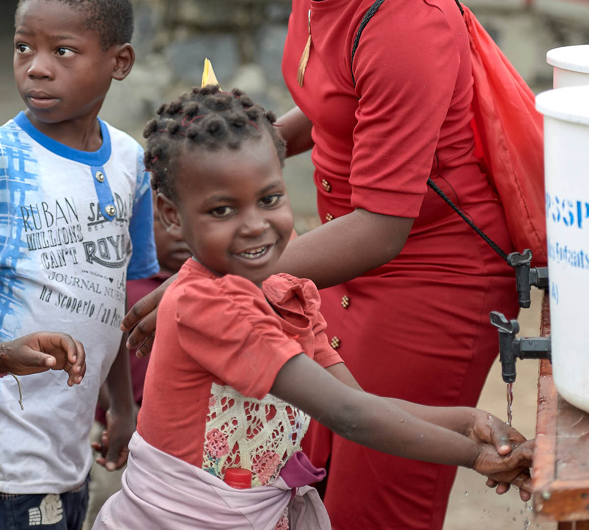 Children wash their hands in a diluted bleach solution in the Heal Africa Church in Goma, a war-torn city in eastern Democratic Republic of the Congo  Such strict hygiene measures are common since the region experienced an outbreak of Ebola beginning in 2018 