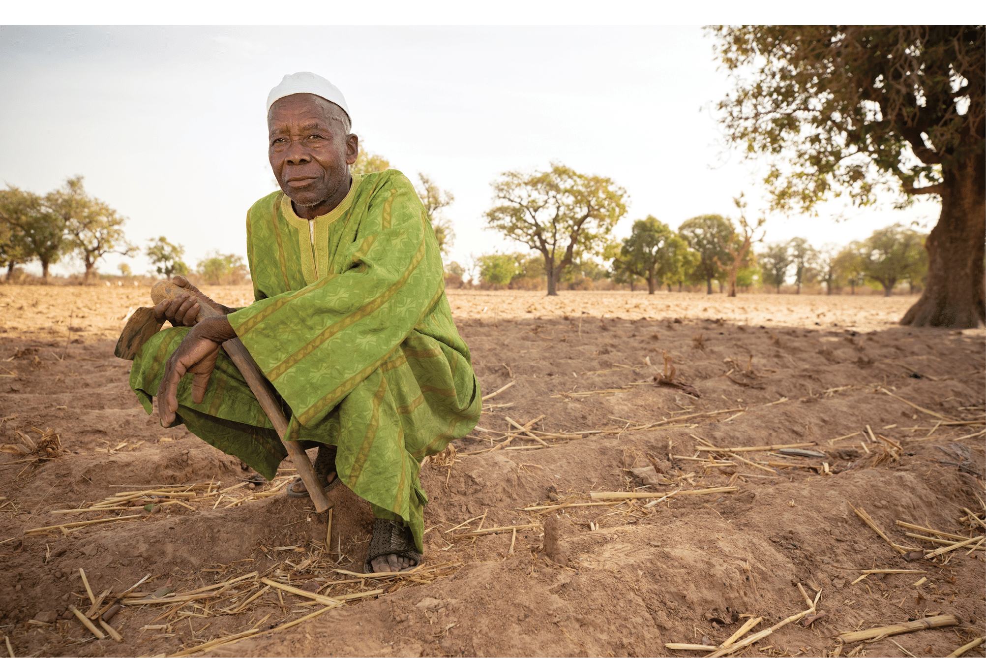 Mahammoud Traore (75) supports a family of 21 people through his farming in the village of Dougouninkoro, Mali  But climate change has affected weather patterns in recent years and he has not been able to grow as much as he used to  Now, his family s food stores always run out before he can harvest his new crop  Consequently, there s always a couple of months every year when the family experiences hunger and they often have to go into debt to buy or borrow food    Sahel 2021 Crisis; Barouéli Cercle, Mali  Feb 22, 2021  Photo by Jake Lyell 